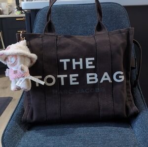 Marc Jacobs Blackish Brown Tote with White Lettering.  Labubu Not Included